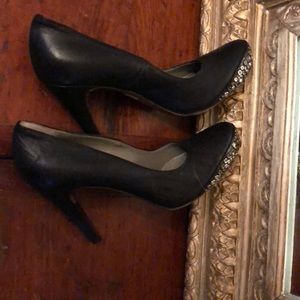 Black leather pumps